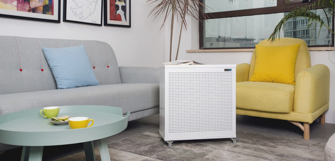 Smart air blast mini air purifier in corner of a living area