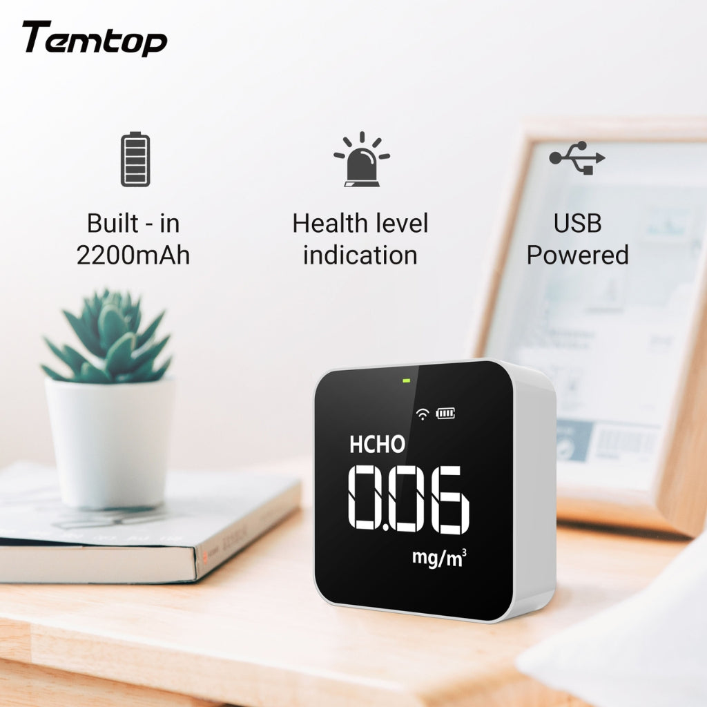 Temtop M10 air quality monitor on a desk with features listed
