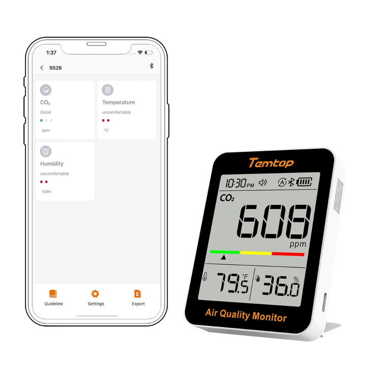 Air quality monitor displaying CO2 levels next to a smartphone app interface.