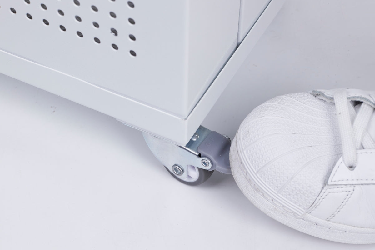 White sneaker activating wheels on smart air blast air purifier on a light grey background