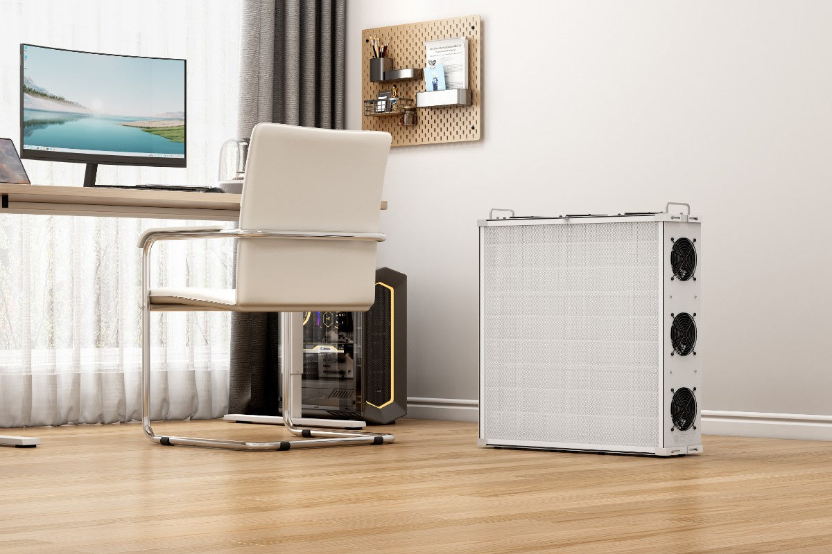 SA700 air purifier on wooden floor next to home office set up