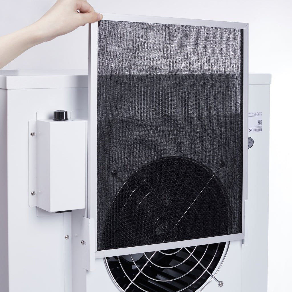 Close up view of person pulling out pre-filter from Smart Air Blast Mini Mk II Air Purifier